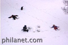 Children of all ages gather in the snow