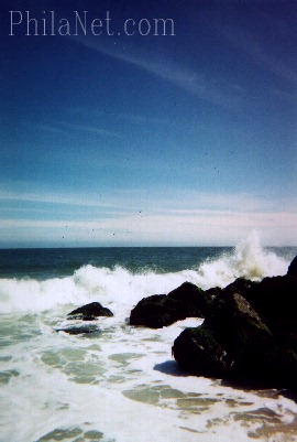 A Wave Breaks on the Rocks in
Cape May, NJ